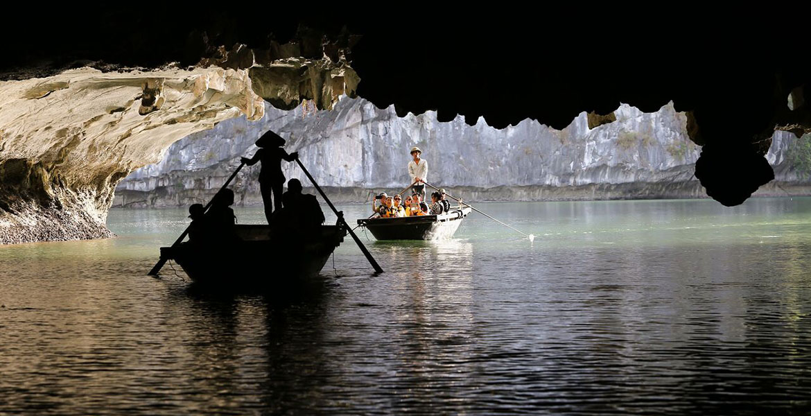 Boating Bright Cave with locals